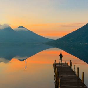 Enchanting Travels Guatemala Tours Observing the incredible beautiful sunrise at Lake Atitlan in Guatemala.