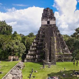 Enchanting Travels Guatemala Tours Tourists at the Gran Plaza at the archaeological site Tikal, Guatemala