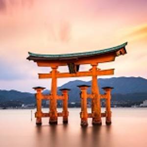 Miyajima, Hiroshima, Japan at the floating gate of Itsukushima Shrine. (gate sign reads Itsukushima Shrine)