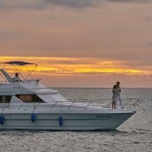 Couples enjoying in cruise during sunset