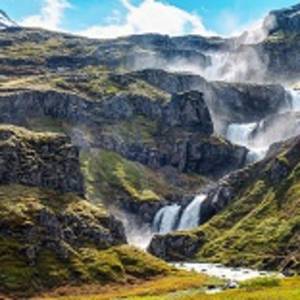 The Klifbrekkufossar waterfall in the Mjoifjordur fjord in Iceland
