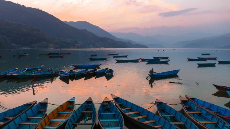 Boats on Phewa Lake at Sunset