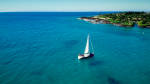 Sailboat sailing in ocean in Hawaii.