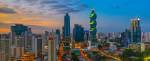 The colorful panoramic skyline of Panama City at sunset with high rise skyscrapers, Panama, Central America.