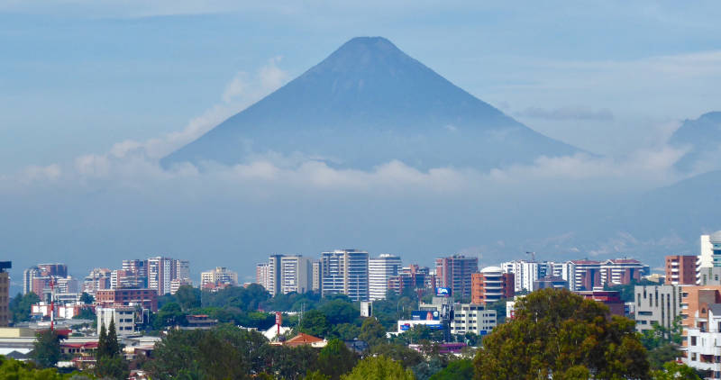 A low cloud base covers part of Fuego volcano in Guatemala City, capital of Guatemala