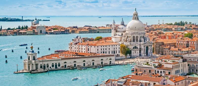 Enchanting Travels Europe Tours Panoramic aerial cityscape of Venice with Santa Maria della Salute church, Veneto, Italy