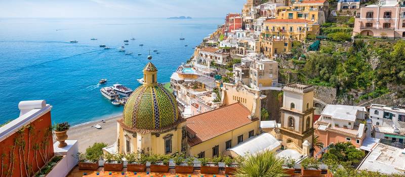 Enchanting Travels Italy Tours Beautiful Positano on hills leading down to coast