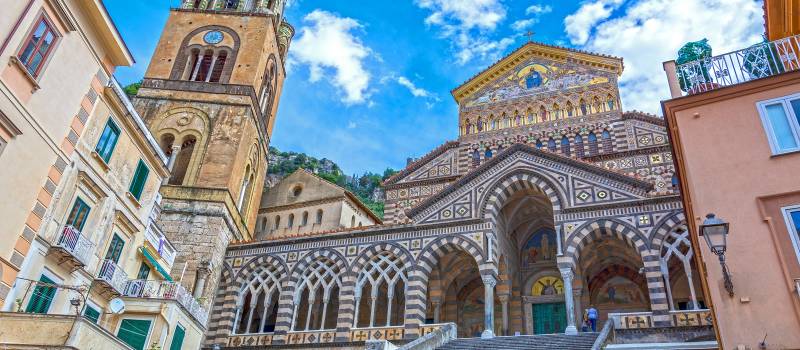 Enchanting Travels Italy Tours Ancient Roman city of Pompeii against Vesuvius volcano