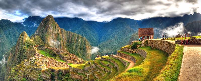 Enchanting Travels Peru Tours - Panoramic HDR image of Machu Picchu, the lost city of the Incas on a cloudy day. Machu Picchu is one of the new 7 Wonder of the Word near Cusco