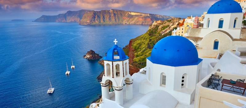 Fira town on Santorini island, Greece. Incredibly romantic sunrise on Santorini.