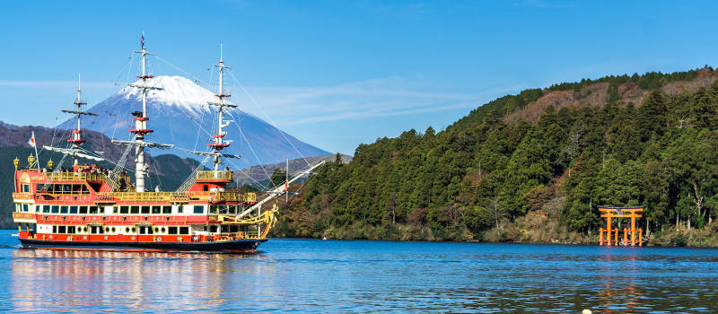 Mountain Fuji and Lake Ashi with Hakone temple and sightseeing boat in autumn