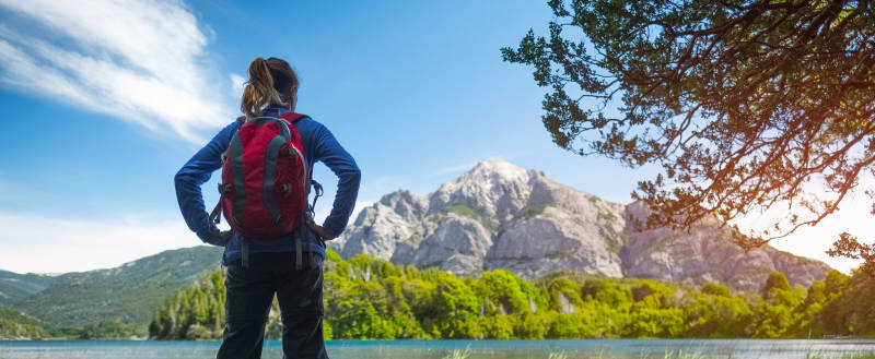 Woman hiker lake and mountains Bariloche, Argentina, South America