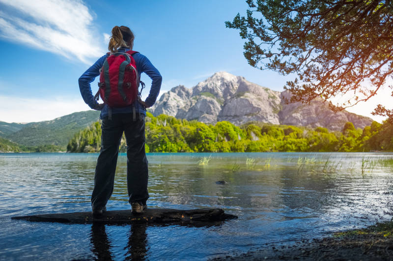 Woman hiker lake and mountains Bariloche, Argentina, South America