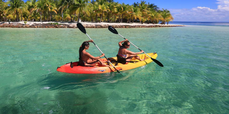 Two women kayaking in Belize