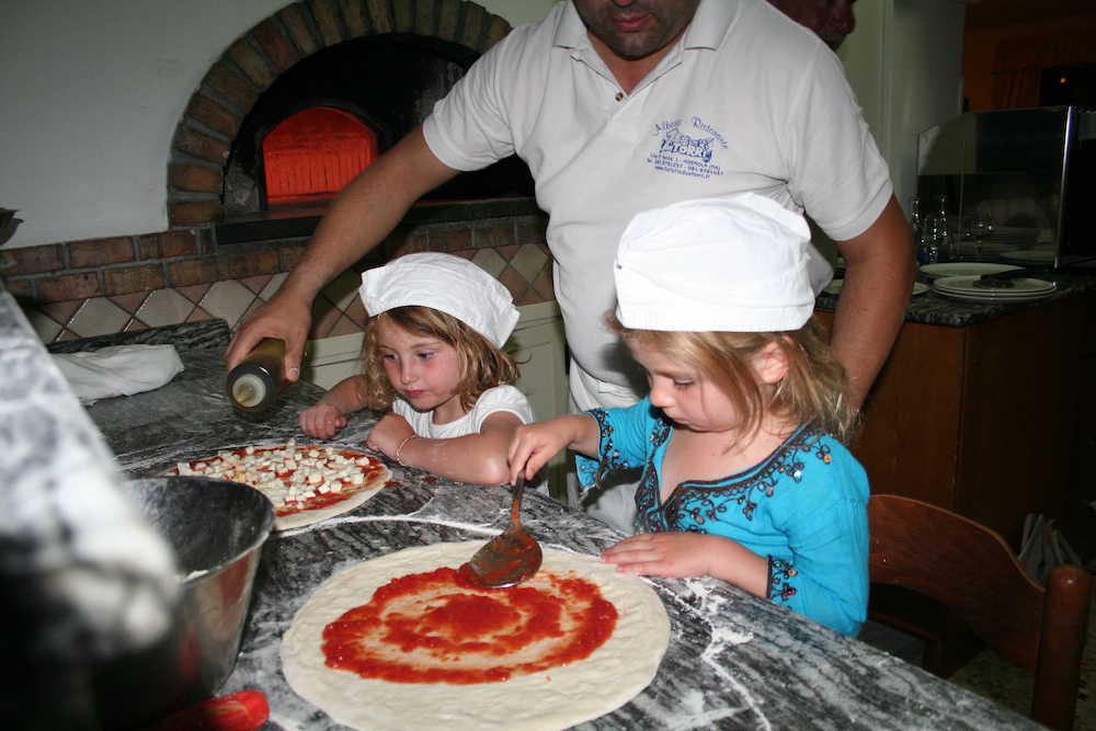 Children making pizza in Italy