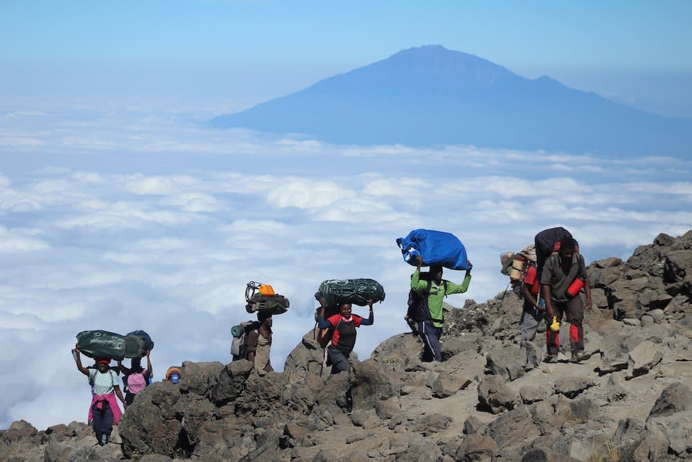 Female porters climbing Kilimnjaro