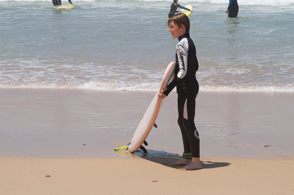 boy with surfboard