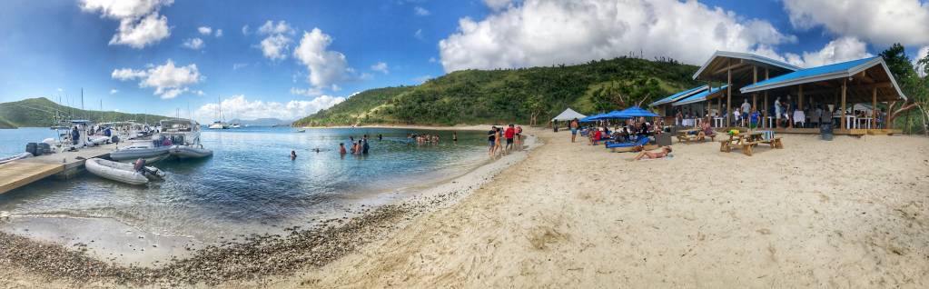 Crowd relaxing on beach