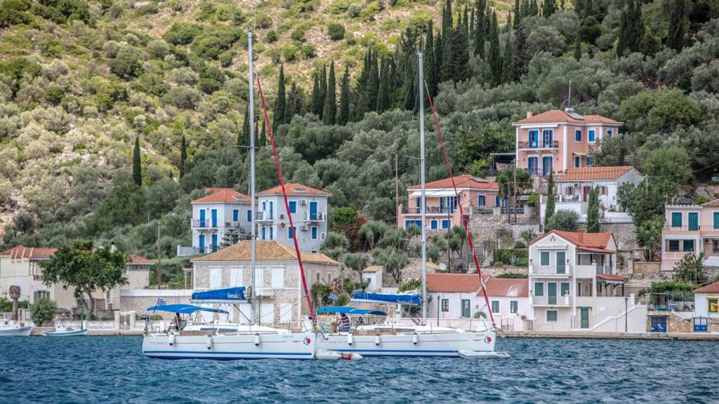 men sailing in Greece