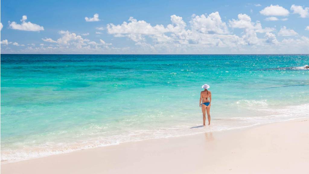 Woman on beach in Bahamas