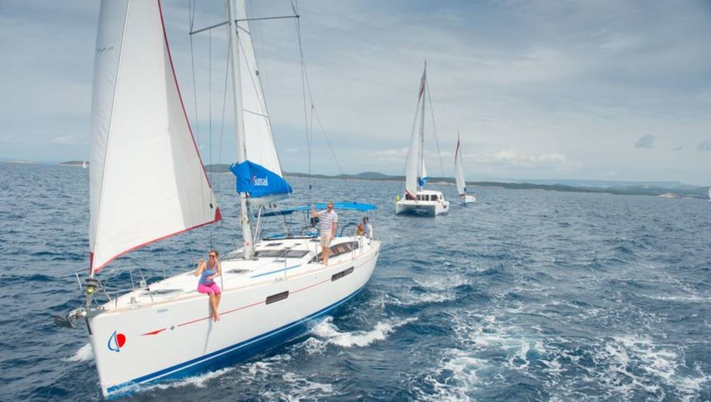 Sunsail monohull catamaran anchoring in Corfu