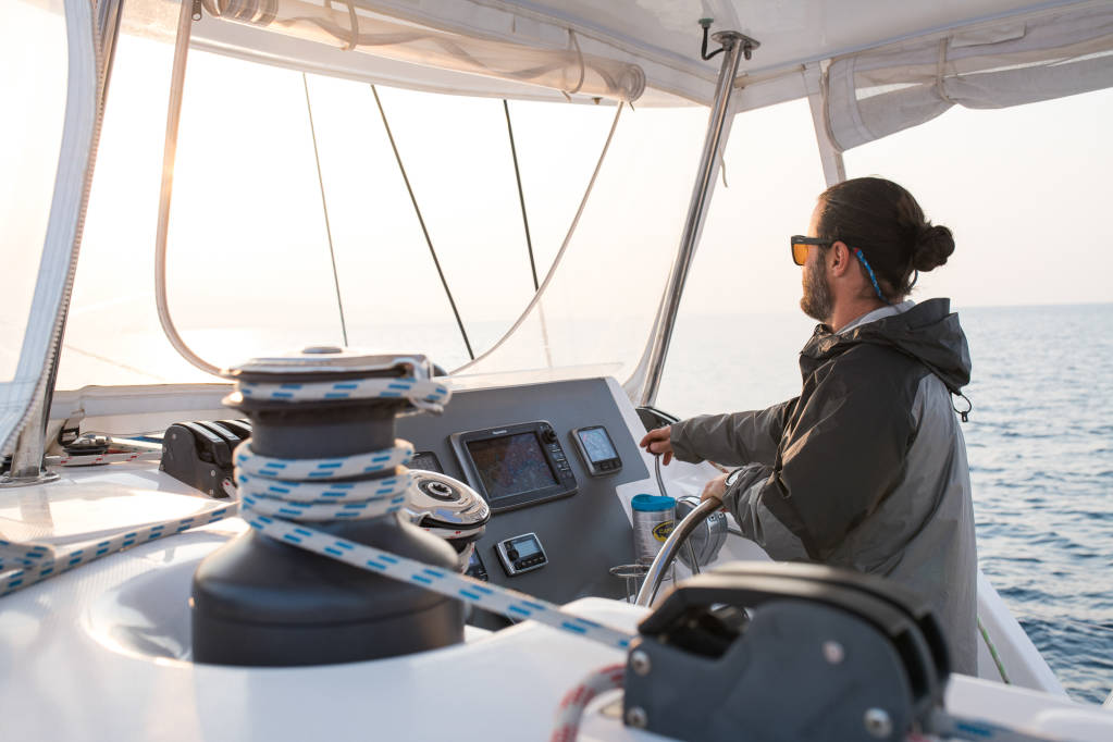 Skipper_at_the_Helm_Yacht_Charter