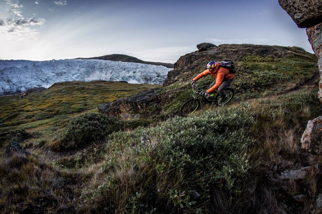 A mountain biker at Russell Glacier near Kangerlussuaq, Greenland.