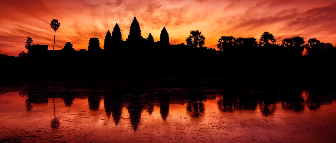 Angkor Wat silhouetted in front of the sunrise