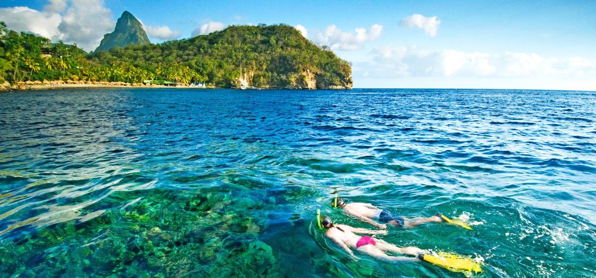 Couple snorkelling in Bluegreen waters of St Lucia