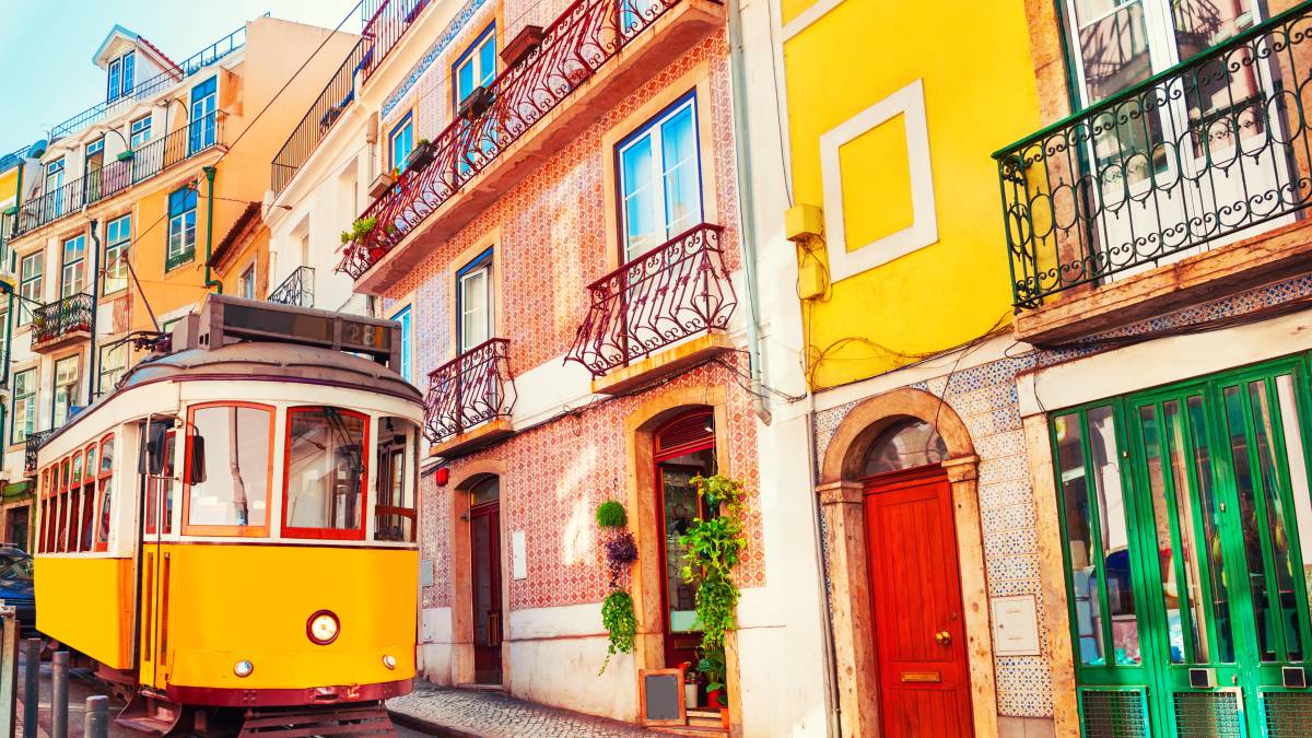 Yellow vintage tram on the street in Lisbon, Portugal
