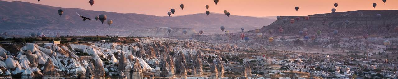 hot air balloons, rock formations, sunset