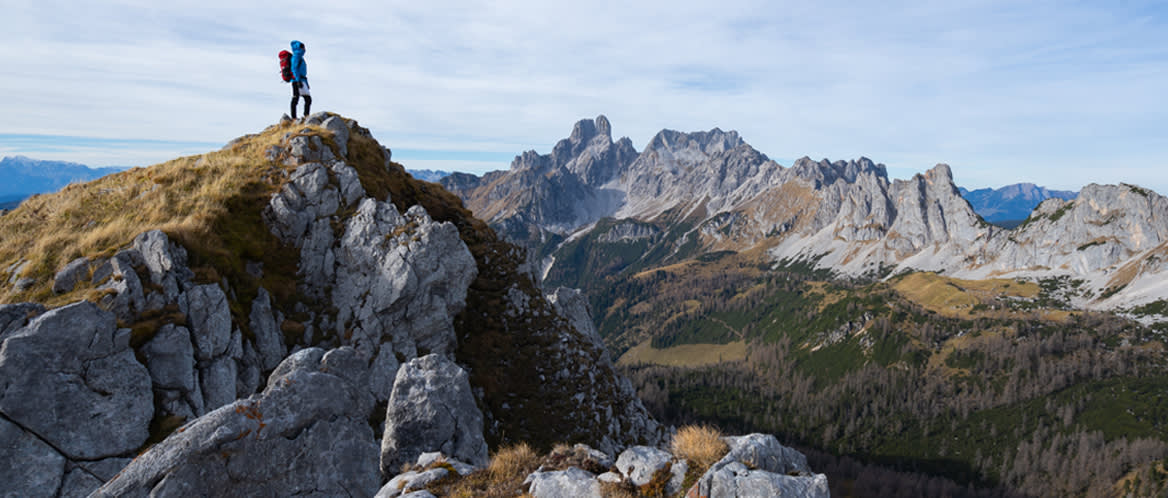 Hiker looks out over the mountains