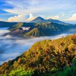 a body of water with a mountain in the background