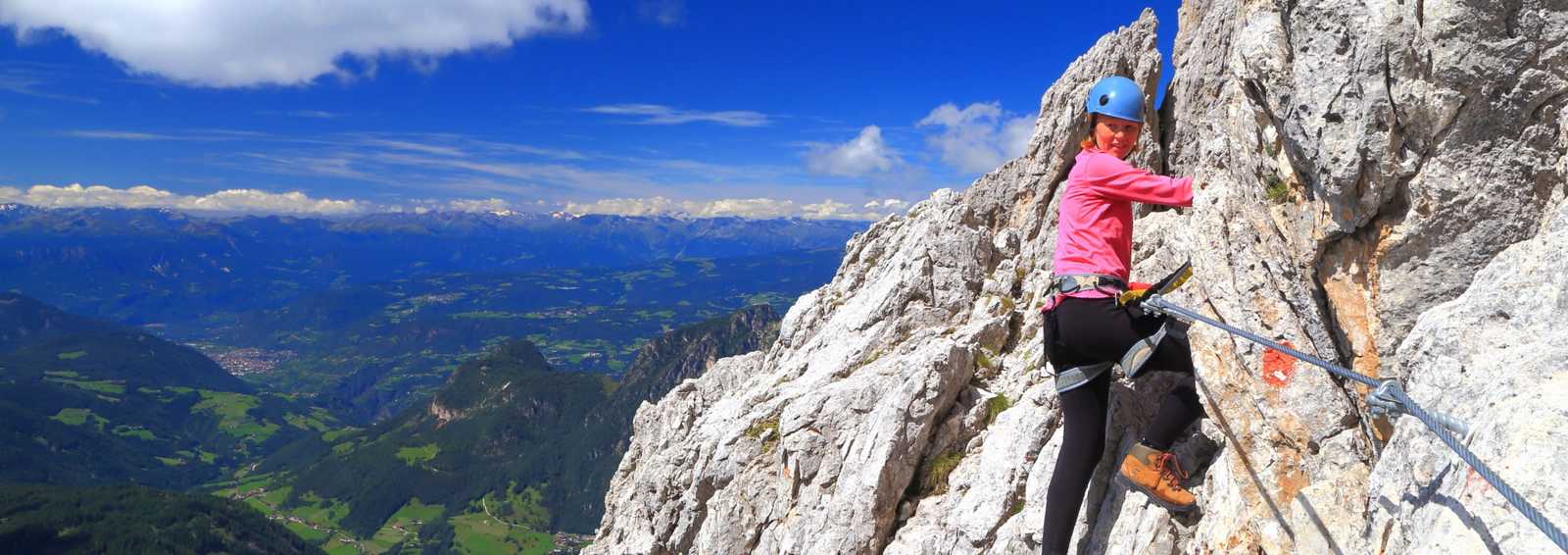 Lady climbing a mountain