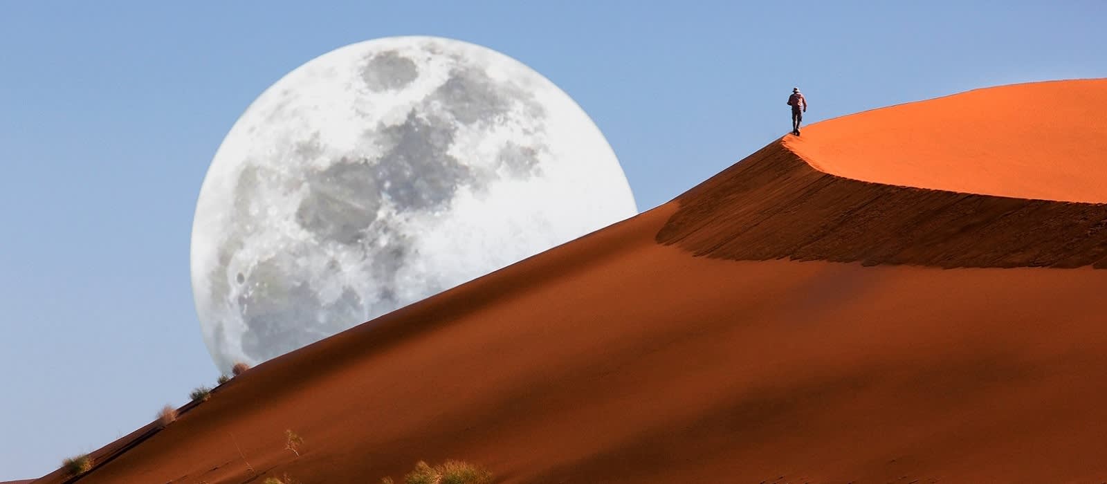 Dune walking in the Namib Desert at Sossusvlei in Namibia