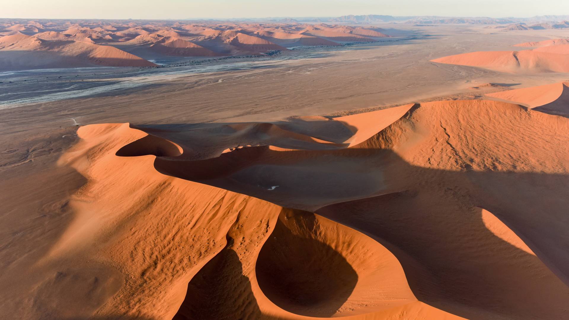 Aerial view of high red dunes, located in the Namib Desert, in the Namib-Naukluft National Park of Namibia, Africa