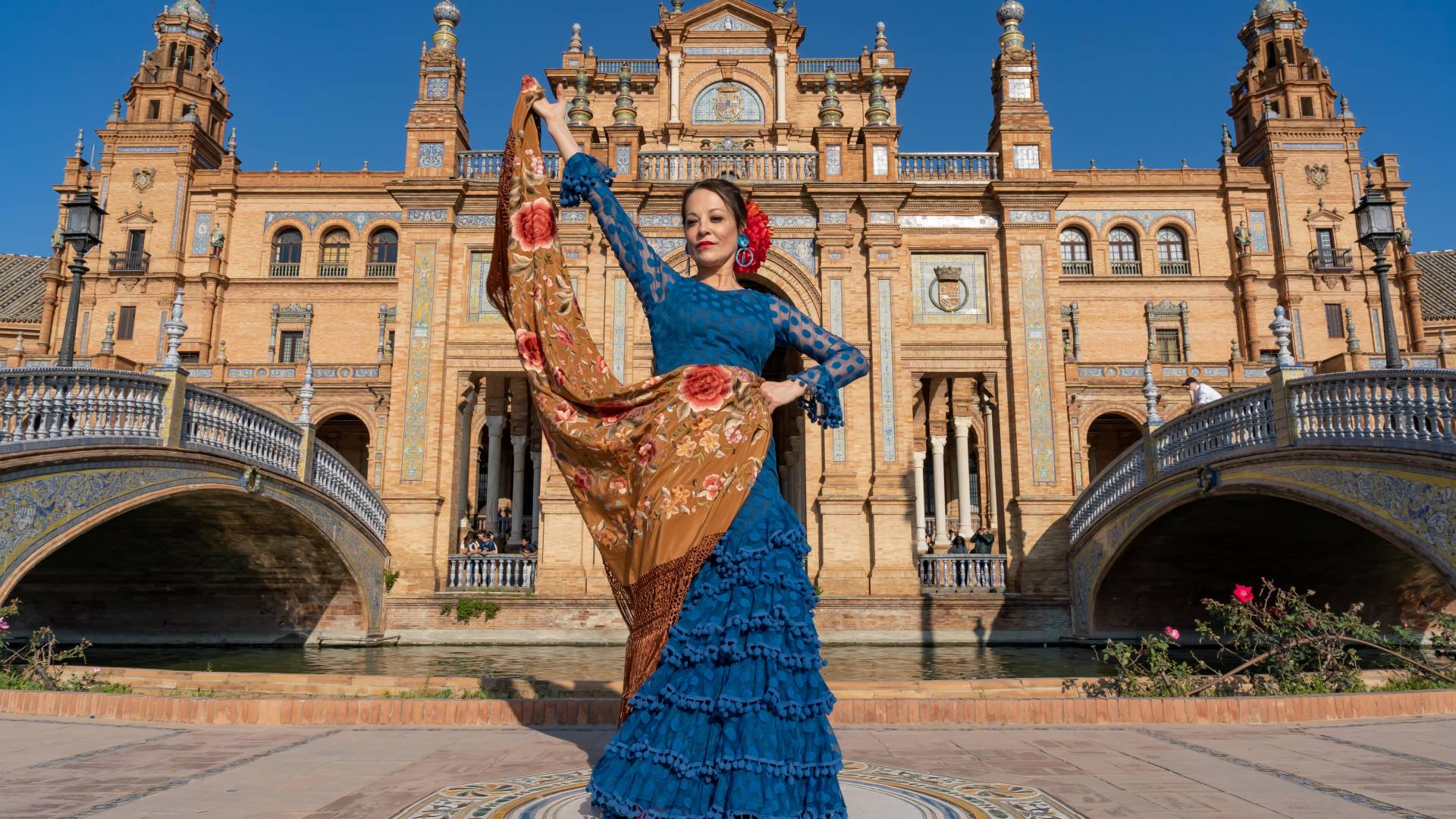 Typical Spanish woman dancing flamenco in Seville, Andalusia, Spain.-min