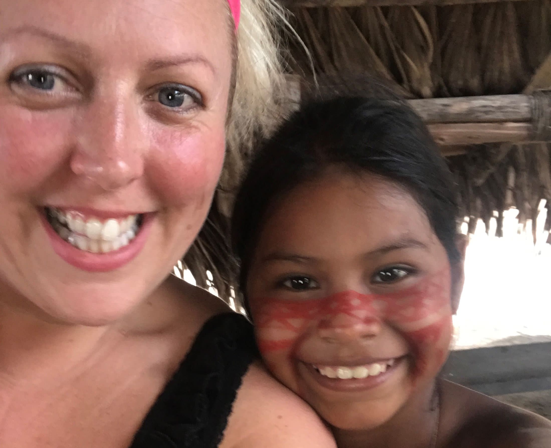 a woman smiling and posing for the camera