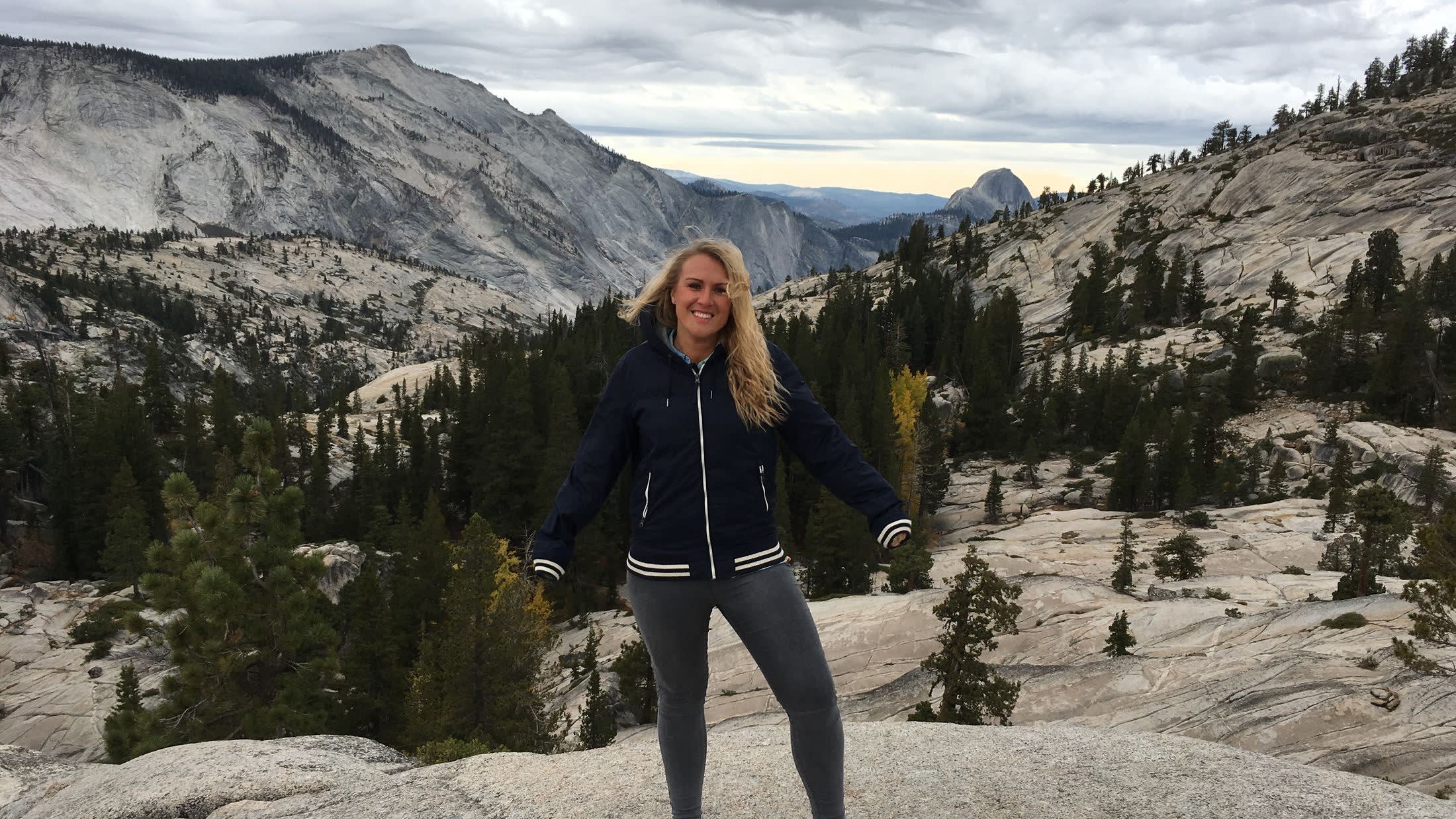 a person standing on a snow covered mountain