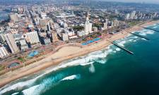 a large body of water with a city in the background