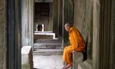 a man sitting in front of a door