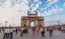 a group of people walking in front of a building