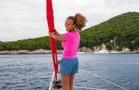 Women Standing on Trampoline of Catamaran in Corfu Greece