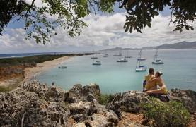 Couple looking out at Tintamarre beach, St. Martin