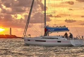 Crew sailing Sun Odysset 490 during sunset