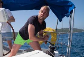 Skipper navigating yacht