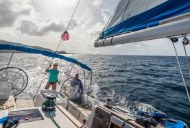 Couple sailing on monohull in the BVI