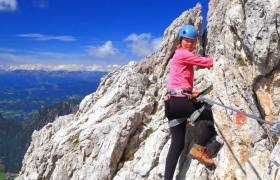 Lady climbing a mountain