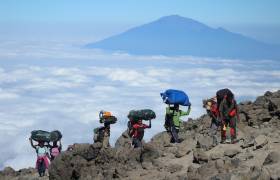 Female porters climbing Kilimnjaro