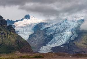 View of Virkisjokull and Falljokull glaciers as seen from route 1, Iceland. These are two of around 30 other outlet glaciers flowing from the ice cap of Vatnajokull, the largest glacier in Iceland